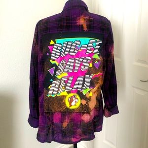 Buc-ee t-shirt patch on purple bleached flannel